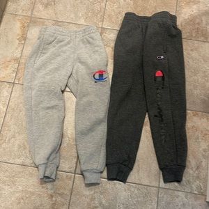 Two pairs of champion sweatpants